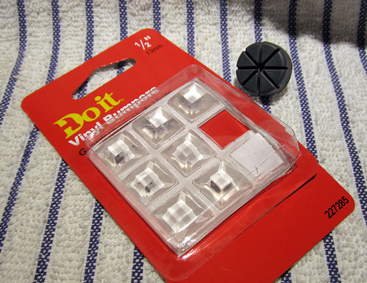 Package of 9 1/2in. plastic self-stick bumpers from the hardware store