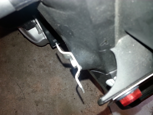 Here's the bracket mounted to the rear location where the round reflector originally was.