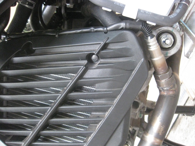 Snug it in right in between the radiator and reservoir... clean install
