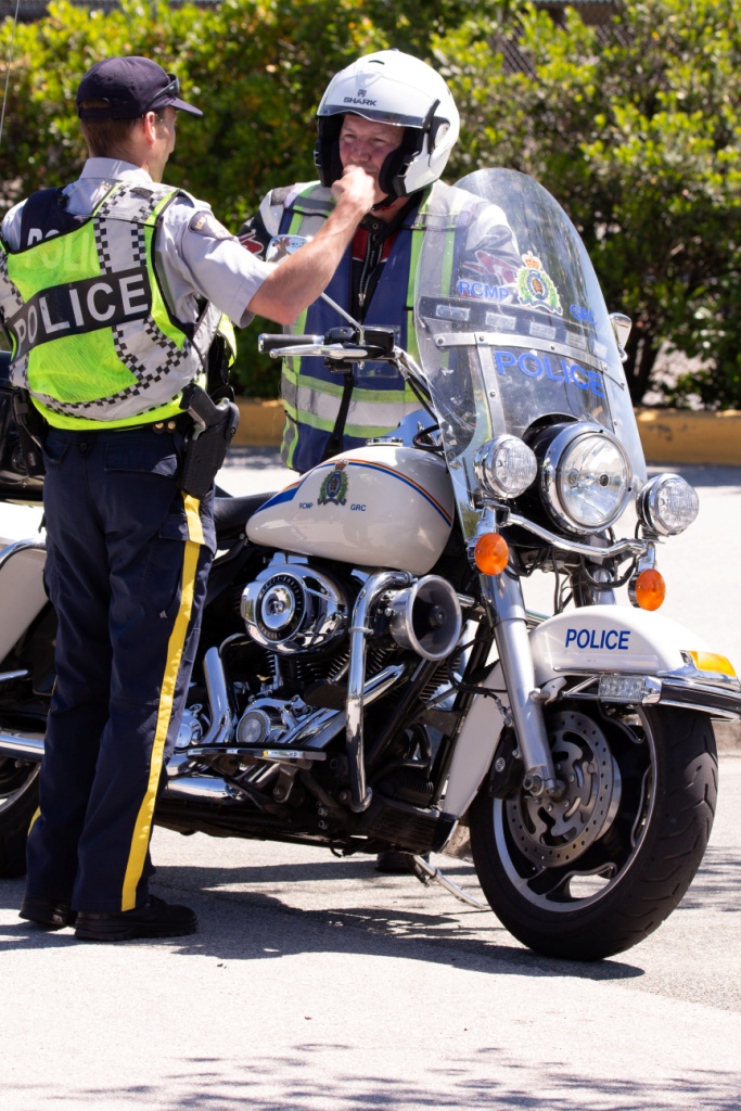 RCMP giving my buddy instructions to drive his Harley