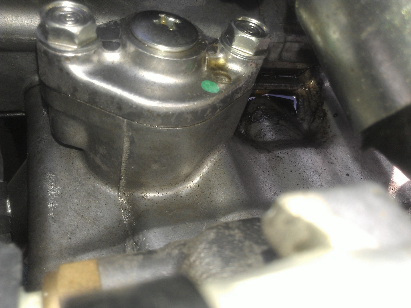 Under the valves is where some of the oil was leaking. I'm not sure if it's coming from a few different places. Given how loose the cover bolts were, I think all of the oil sprayed out from there.