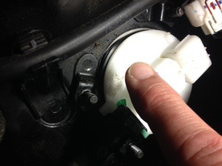 View of fuel pump still in tank with o ring popping out . Note  o ring is under ,dust seal