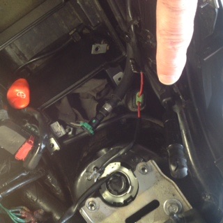 Seat opener location is under seat in left front part of seat 50% is there and the other 50 % is under cargo tray
